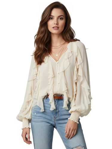 Woman wearing a white ruffled blouse and blue jeans on a white background